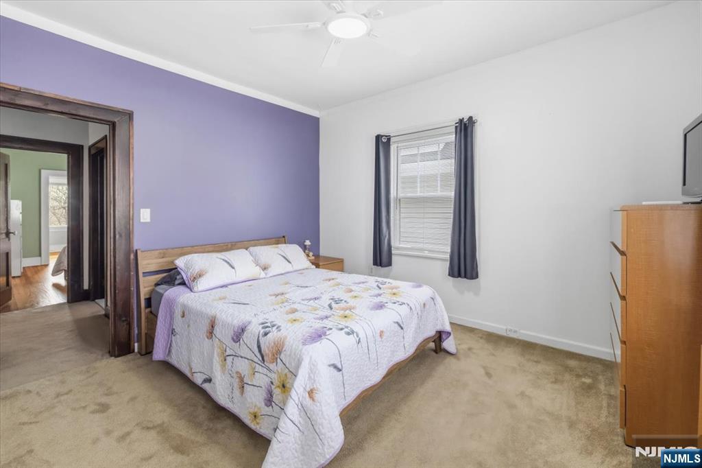 119 Overpeck Avenue Ridgefield Park, NJ 07660 - Photo 19 of 44 a bedroom with a bed and a window