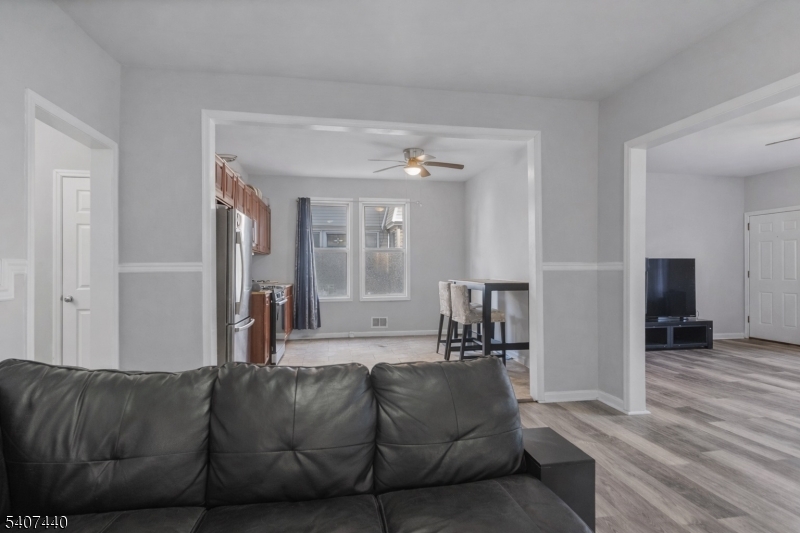 105 Huntington Terrace Newark, NJ 07112 - Photo 11 of 20 a living room with furniture and a wooden floor