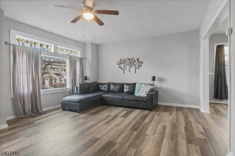 105 Huntington Terrace Newark, NJ 07112 - Photo 12 of 20 a living room with furniture and a large window