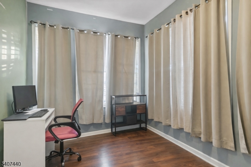 105 Huntington Terrace Newark, NJ 07112 - Photo 14 of 20 a view of a workspace with furniture and a window