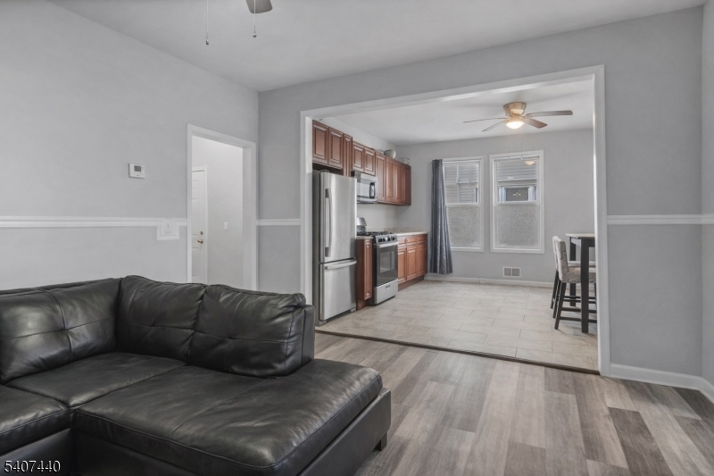 105 Huntington Terrace Newark, NJ 07112 - Photo 17 of 20 a living room with furniture and wooden floor