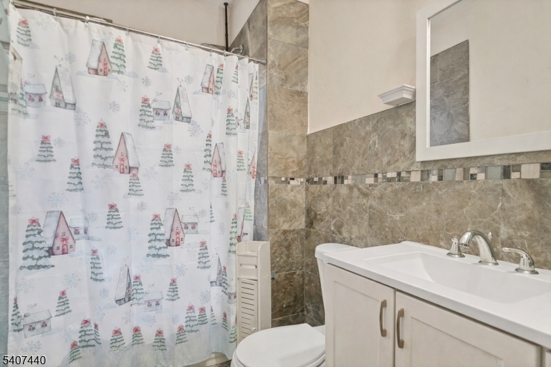 105 Huntington Terrace Newark, NJ 07112 - Photo 2 of 20 a bathroom with a sink toilet and shower