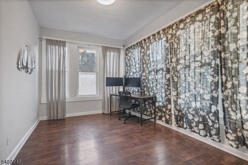 105 Huntington Terrace Newark, NJ 07112 - Photo 9 of 20 a view of a workspace with furniture and a window