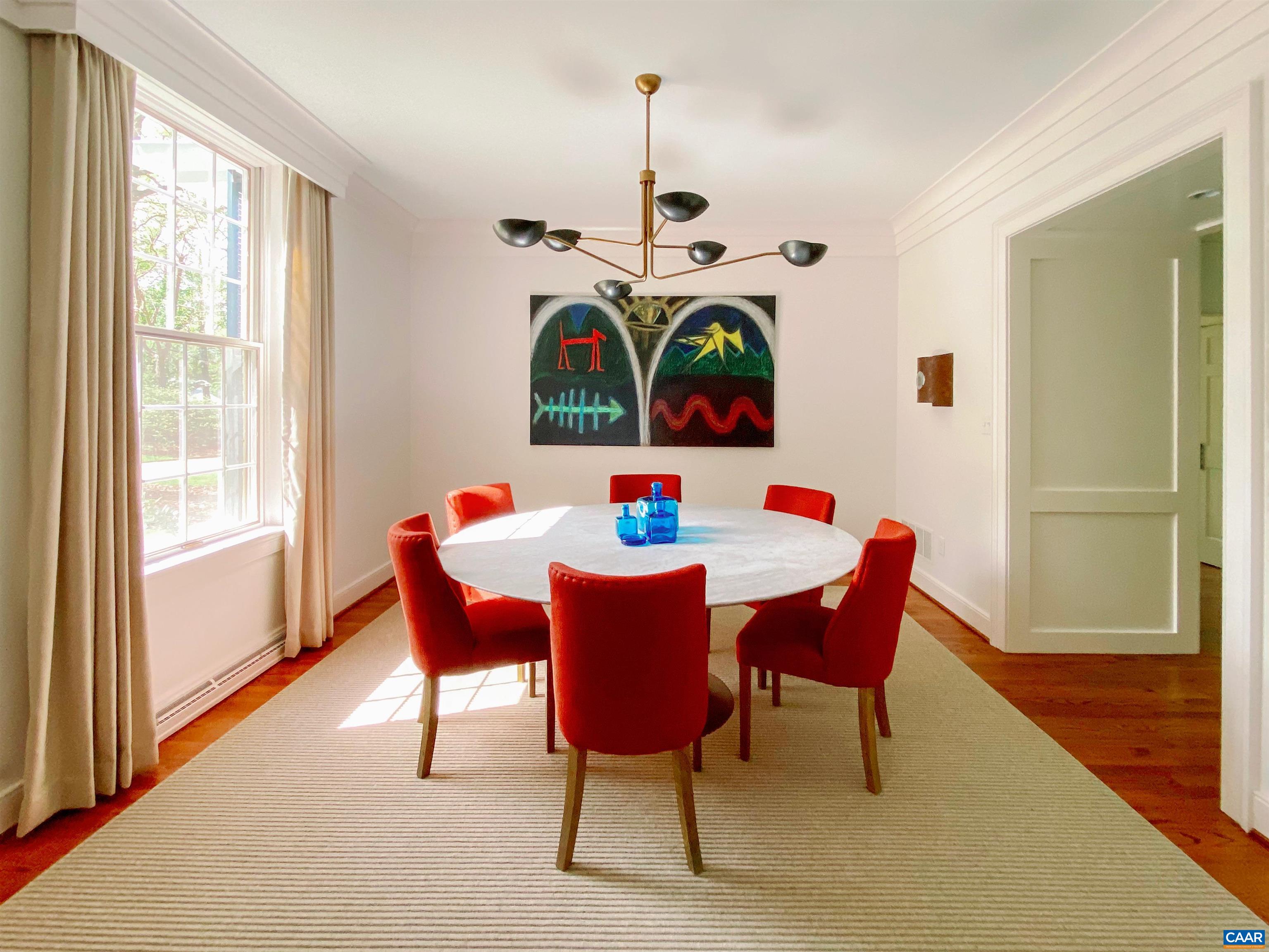 1929 Blue Ridge Road Charlottesville, VA 22903 - Photo 13 of 44 a dining room with furniture a rug a potted plant and a chandelier