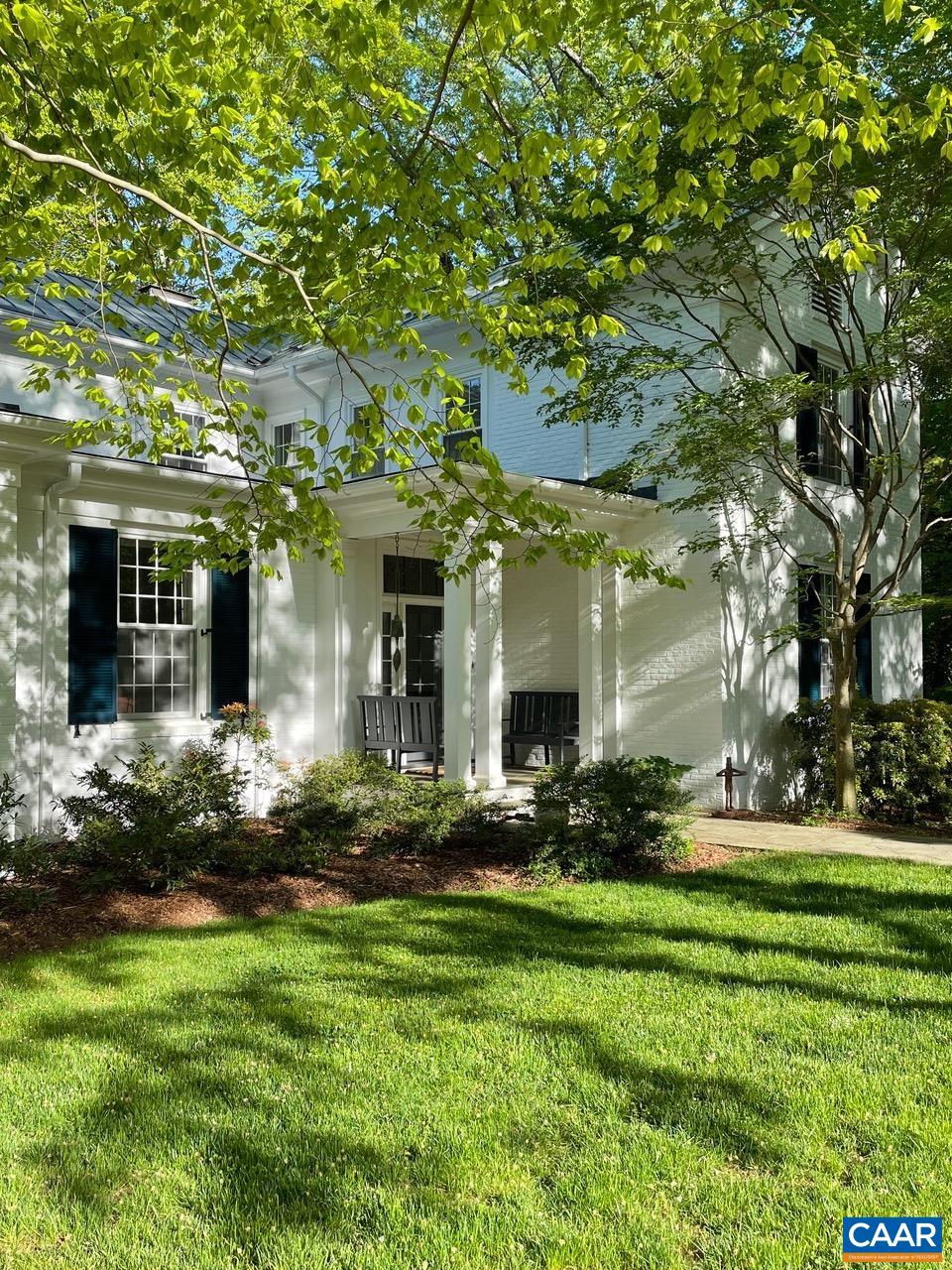 1929 Blue Ridge Road Charlottesville, VA 22903 - Photo 5 of 44 a front view of a house with a yard