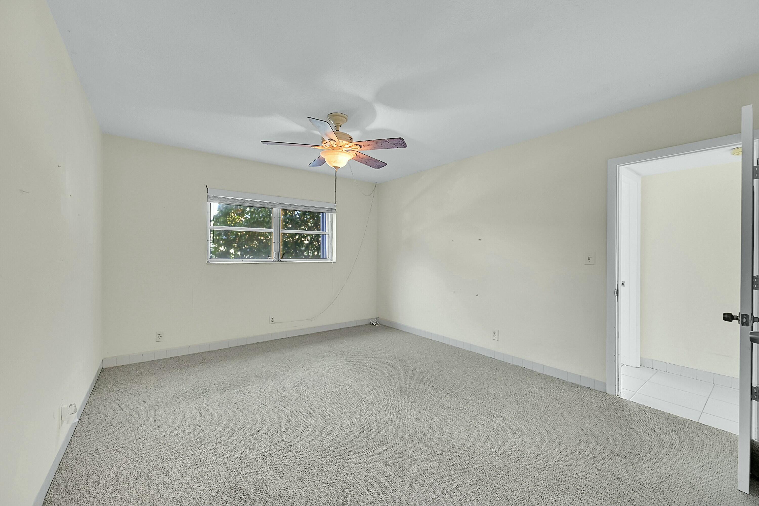 2110 Northeast 42nd Street, Unit 1B Lighthouse Point, FL 33064 - Photo 18 of 45 Primary Bedroom