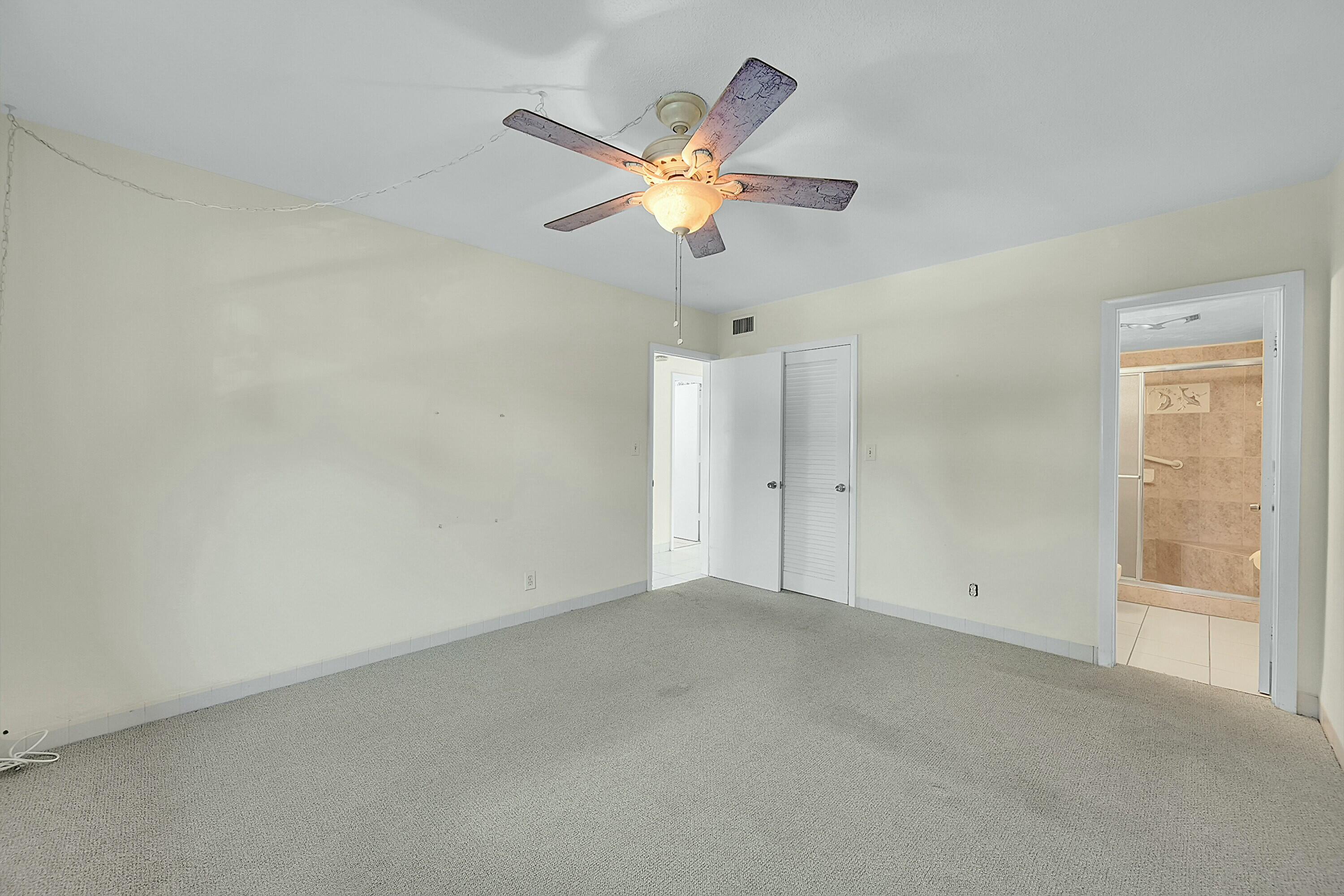 2110 Northeast 42nd Street, Unit 1B Lighthouse Point, FL 33064 - Photo 19 of 45 Primary Bedroom