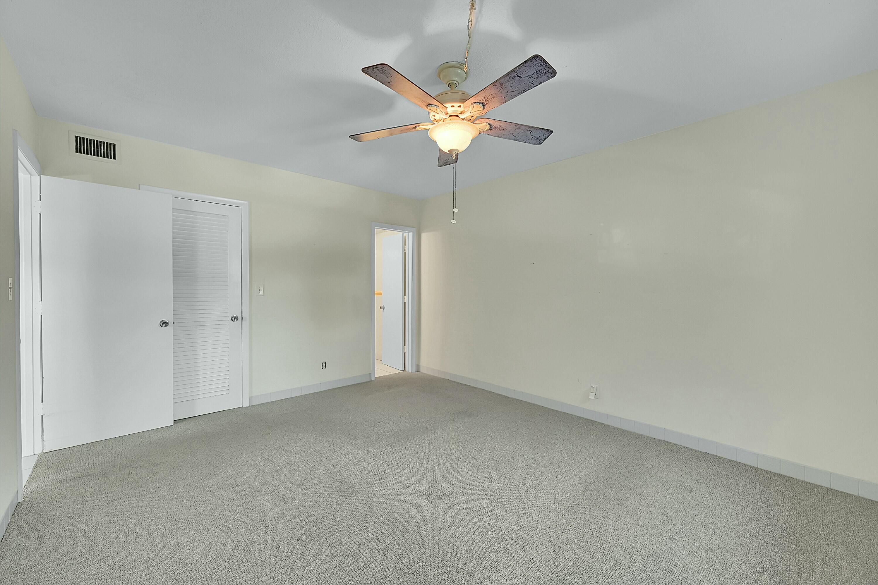 2110 Northeast 42nd Street, Unit 1B Lighthouse Point, FL 33064 - Photo 20 of 45 Primary Bedroom