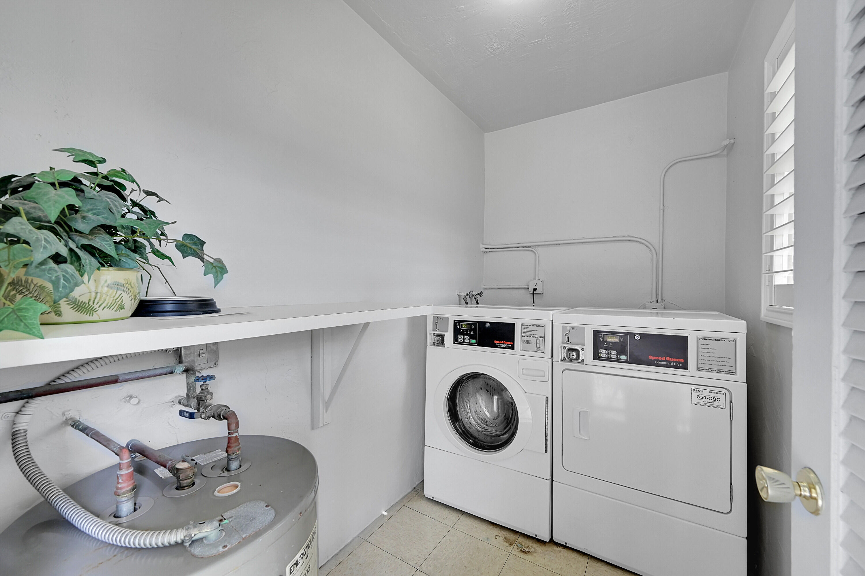 2110 Northeast 42nd Street, Unit 1B Lighthouse Point, FL 33064 - Photo 29 of 45 Common Laundry