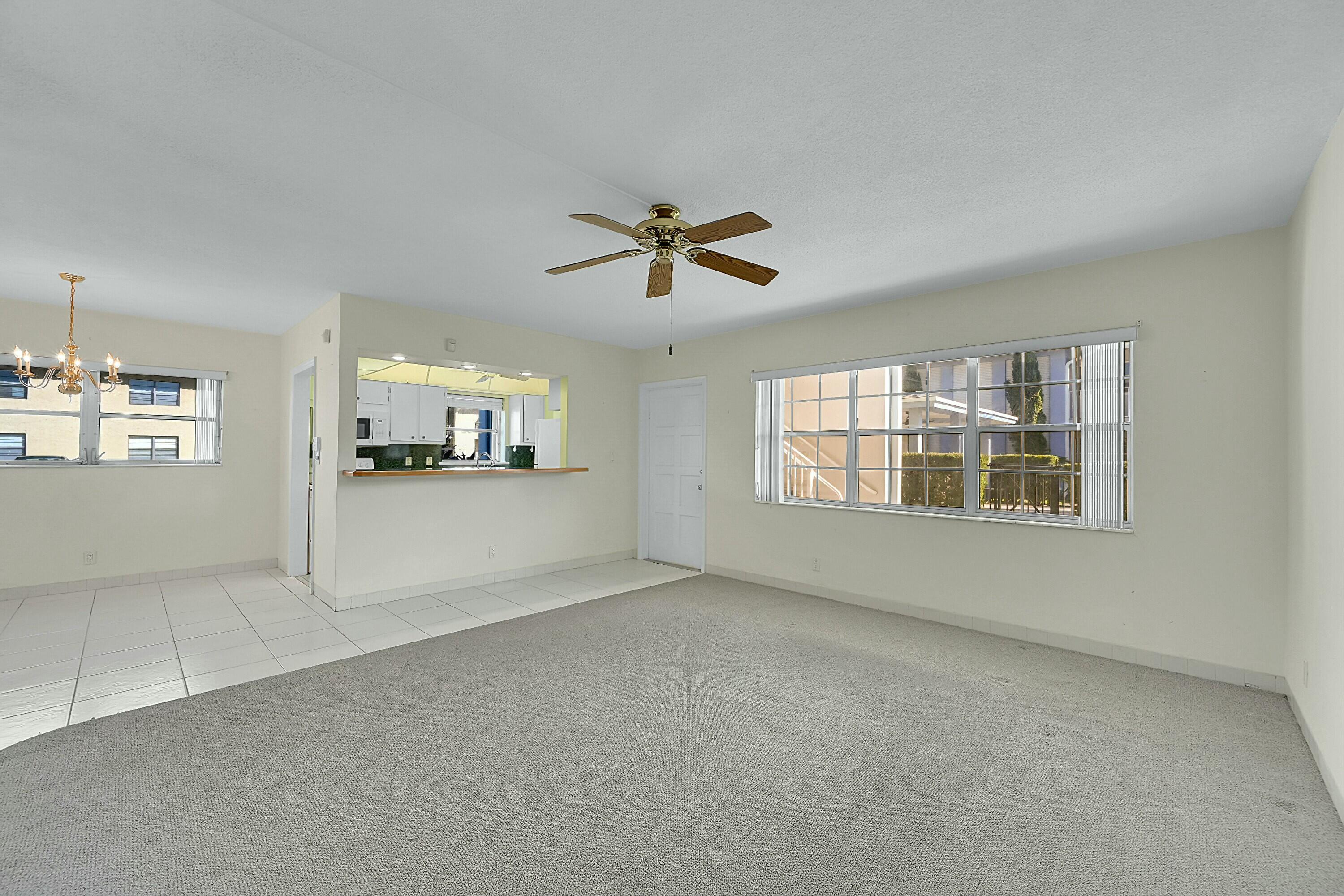 2110 Northeast 42nd Street, Unit 1B Lighthouse Point, FL 33064 - Photo 10 of 45 Living and Dining Area