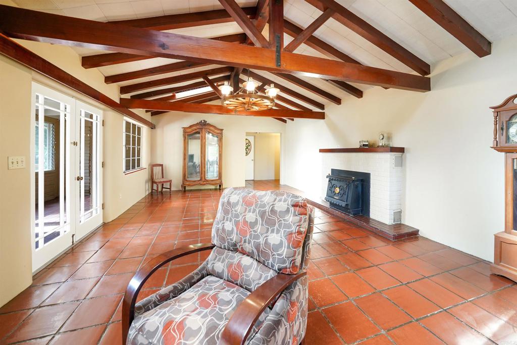 1077 Pine Street Ramona, CA 92065 - Photo 13 of 51 a roof deck with fireplace and wooden floor