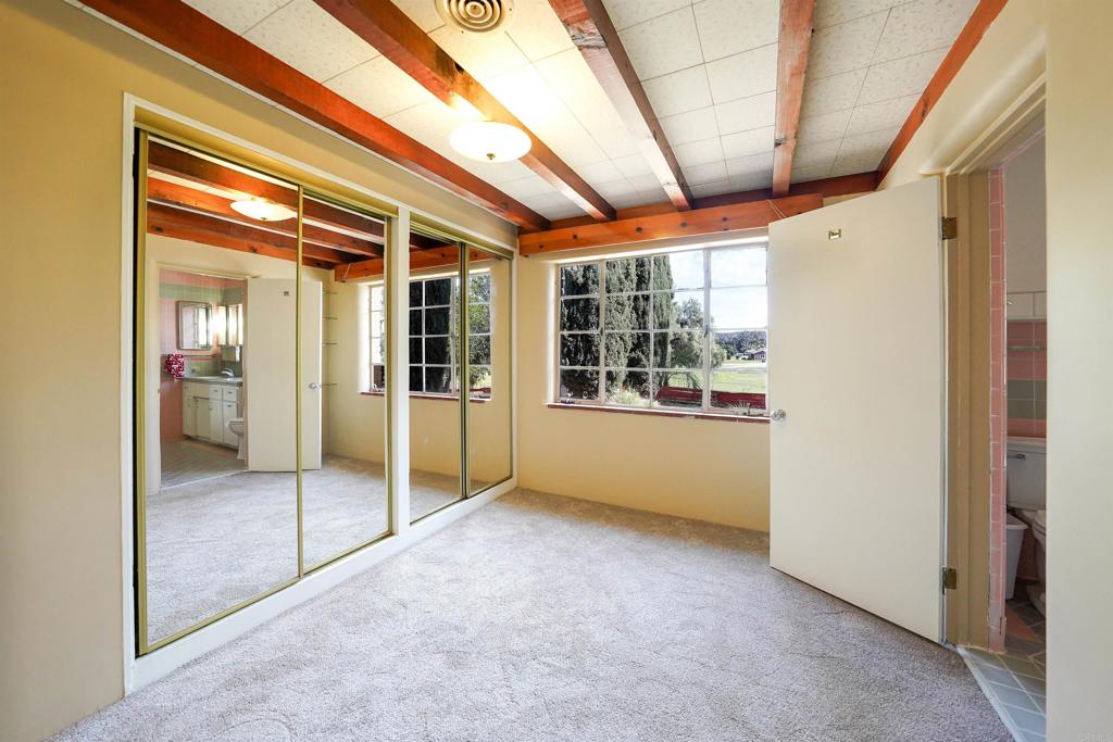 1077 Pine Street Ramona, CA 92065 - Photo 18 of 51 a view of empty room with wooden floor and windows