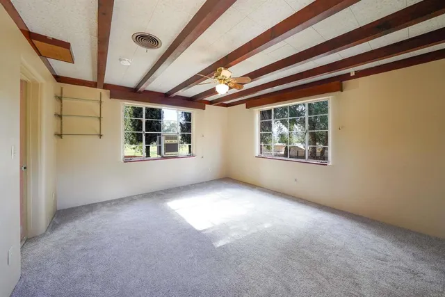 a view of empty room with windows