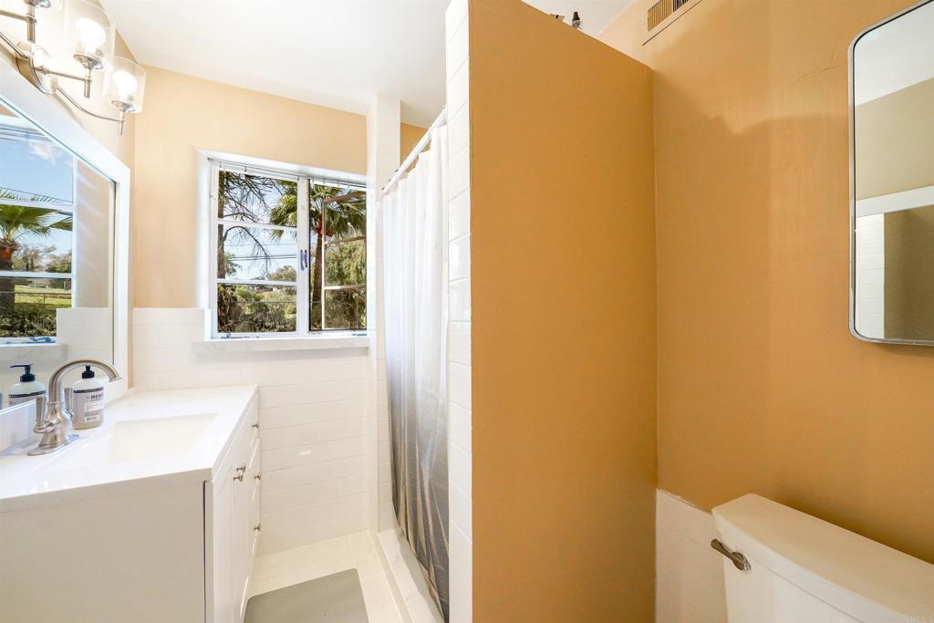 1077 Pine Street Ramona, CA 92065 - Photo 24 of 51 a bathroom with a sink and a mirror