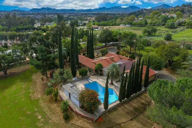 a view of swimming pool with outdoor seating