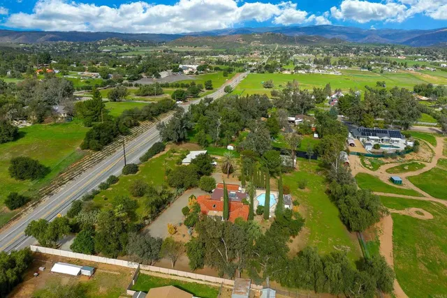 a view of backyard with sitting area