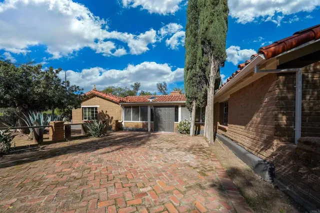 a house with trees in the background
