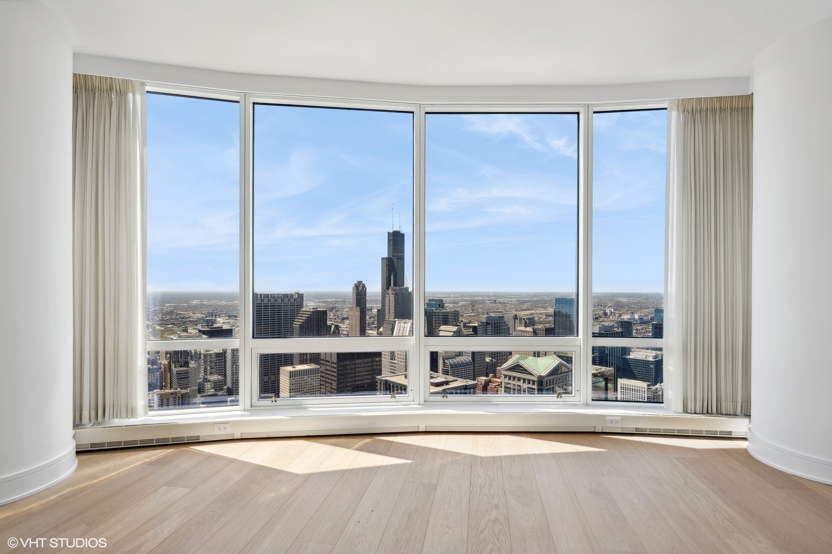 401 North Wabash Avenue, Unit 69E Chicago, IL 60611 - Photo 28 of 62 a view of a living room with a large window and wooden floor