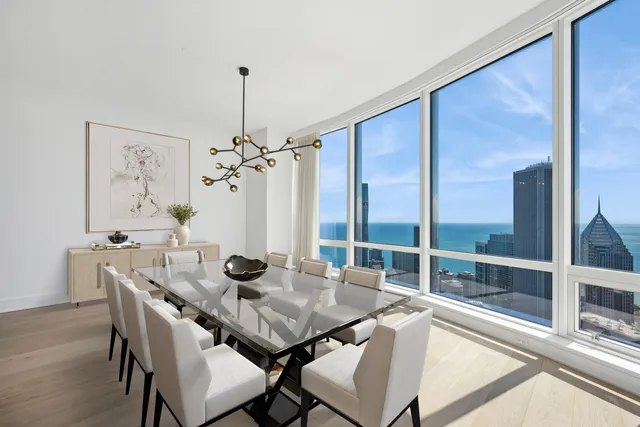 a view of a dining room with furniture window and outside view