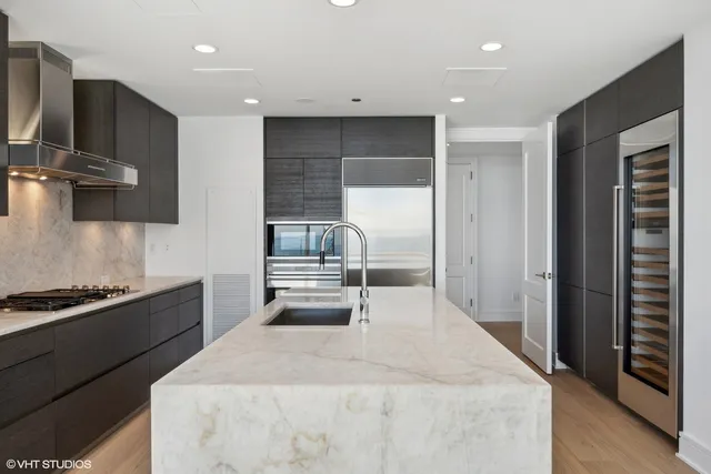 a kitchen with a stove and a refrigerator