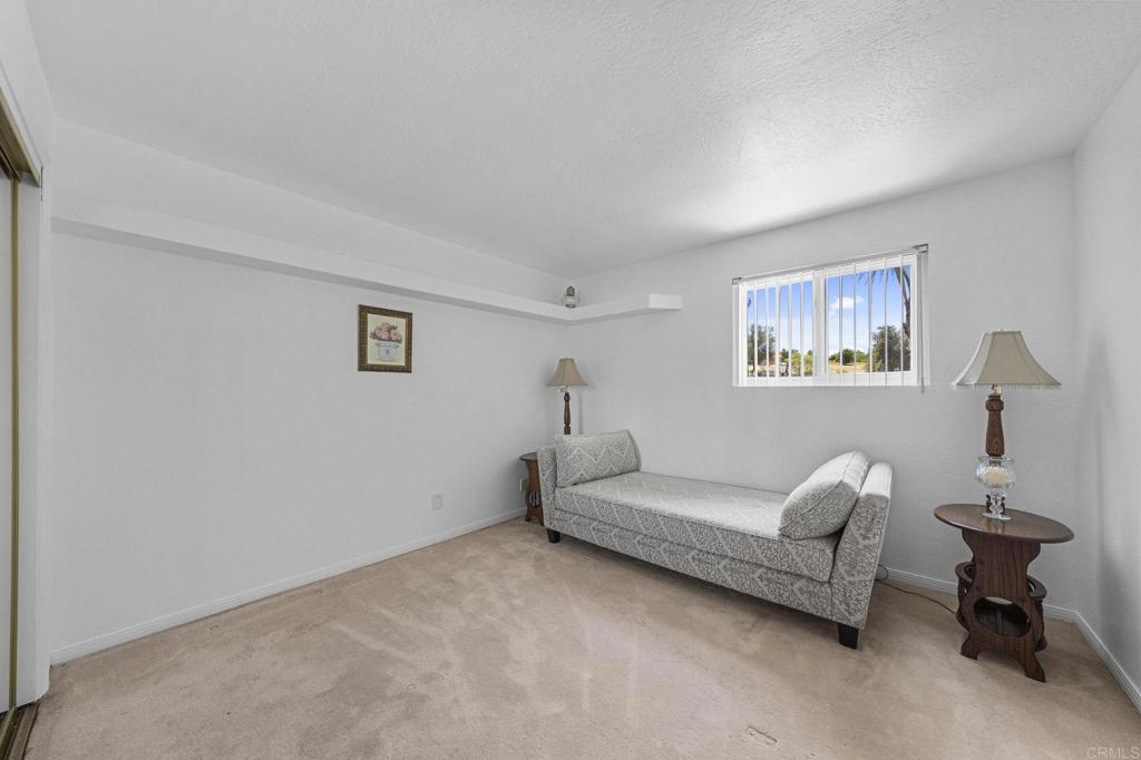 30265 Miller Road Valley Center, CA 92082 - Photo 30 of 56 a living room with furniture and a lamp