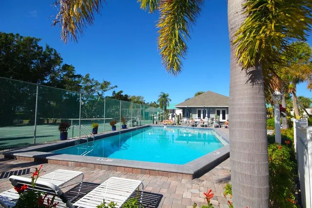a view of a swimming pool with a patio