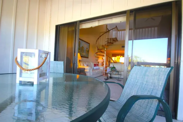 a view of a living room with furniture and window
