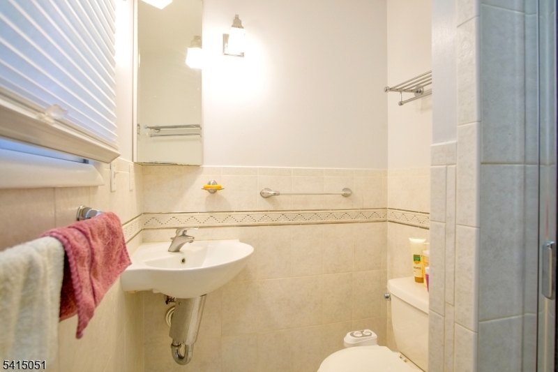 4 Budd Street Ledgewood, NJ 07852 - Photo 17 of 22 a bathroom with a sink toilet and shower