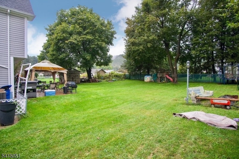 4 Budd Street Ledgewood, NJ 07852 - Photo 20 of 22 a view of backyard with swimming pool and green space