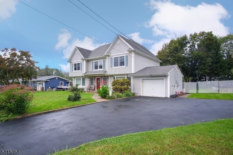 4 Budd Street Ledgewood, NJ 07852 - Photo 2 of 22 a front view of a house with a garden and trees