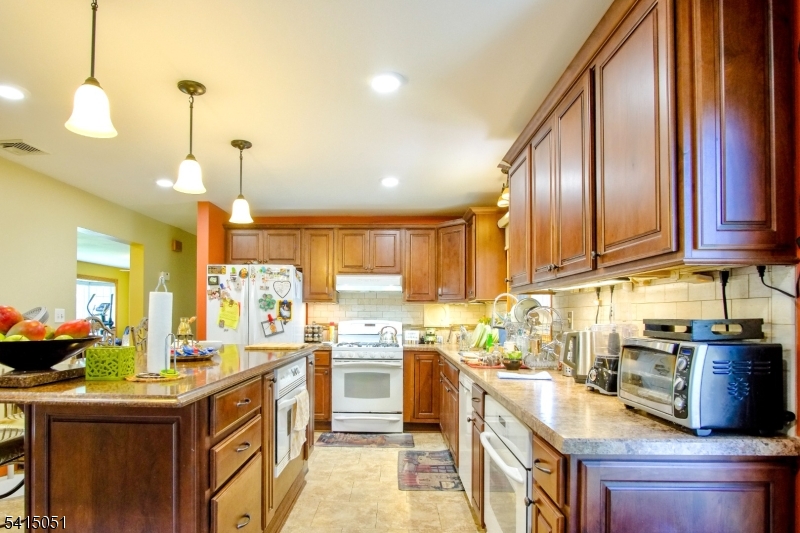 4 Budd Street Ledgewood, NJ 07852 - Photo 5 of 22 a kitchen with stainless steel appliances granite countertop a sink a stove and a wooden floors
