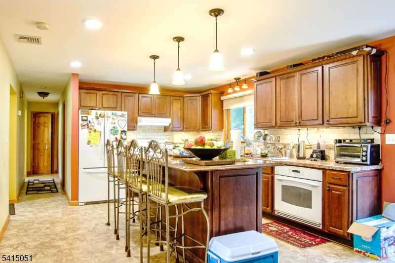 4 Budd Street Ledgewood, NJ 07852 - Photo 6 of 22 a kitchen with stainless steel appliances granite countertop a stove a sink dishwasher and a refrigerator with wooden cabinets