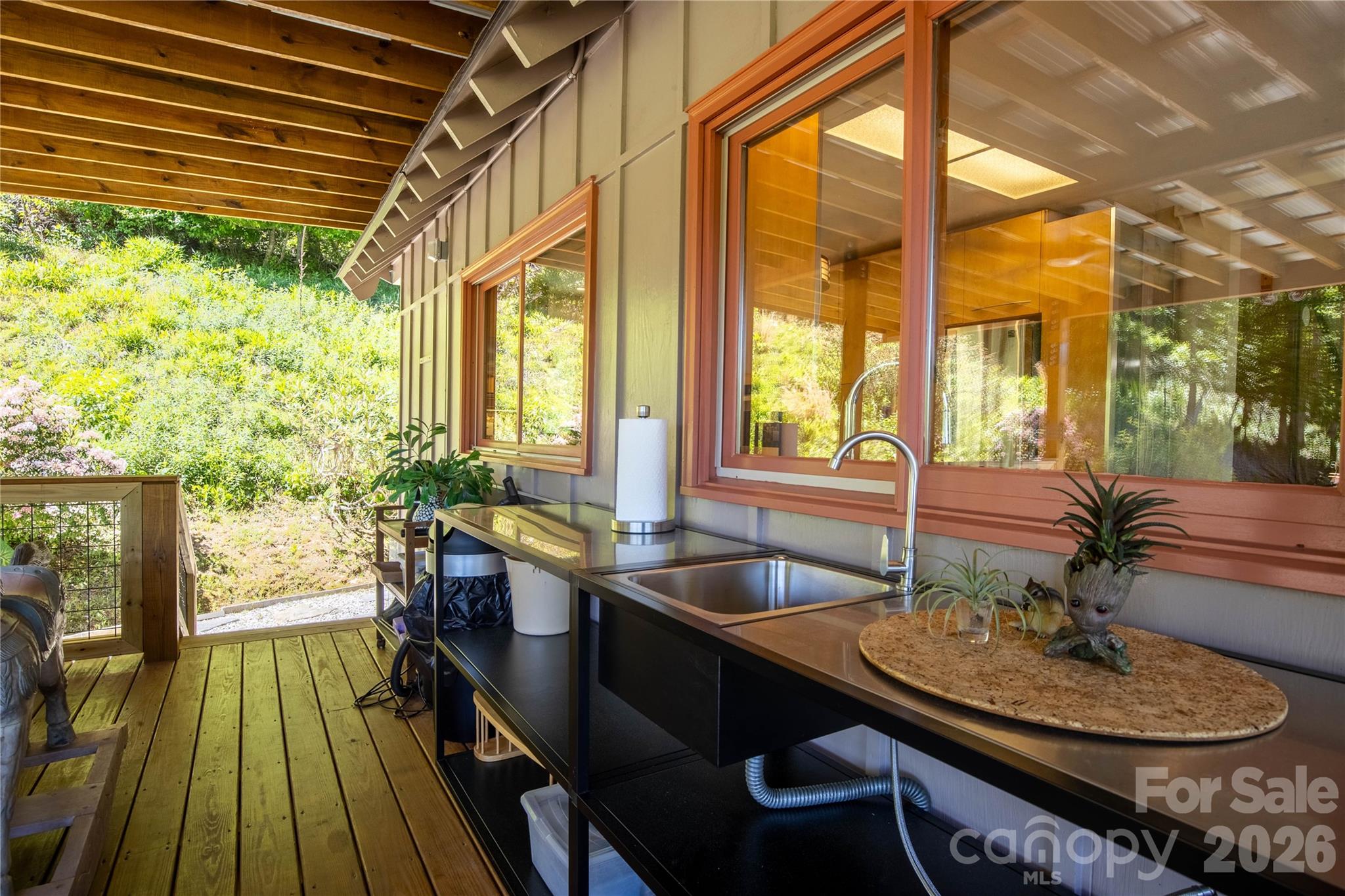 93 Franklin Crest Road Spruce Pine, NC 28777 - Photo 22 of 47 a room with wooden floor table and chairs