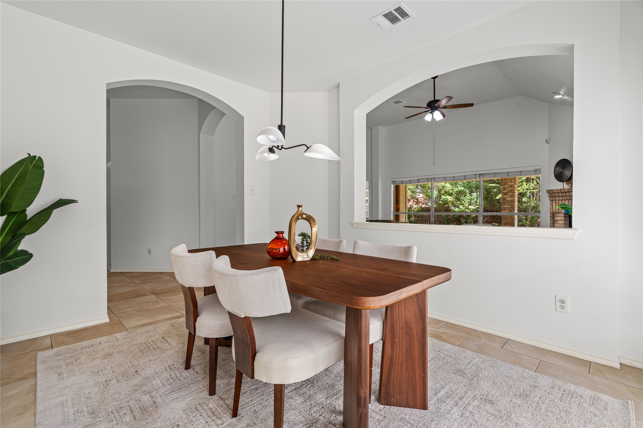 2920 Warwick Way Austin, TX 78748 - Photo 3 of 36 An inviting formal dining room features elegant arched doorways and fresh interior paint with new fixtures