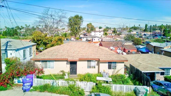 a picture of a bench in front of a house