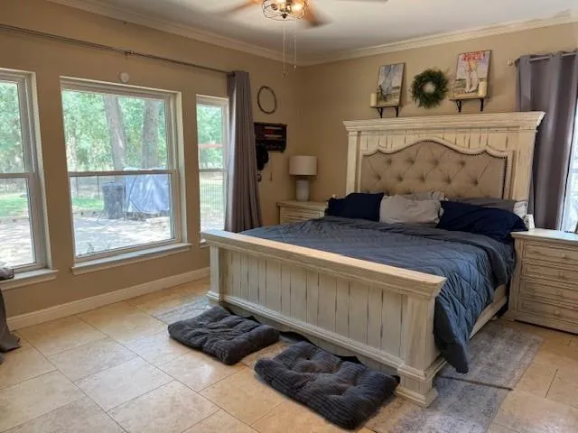 a bedroom with a bed and window
