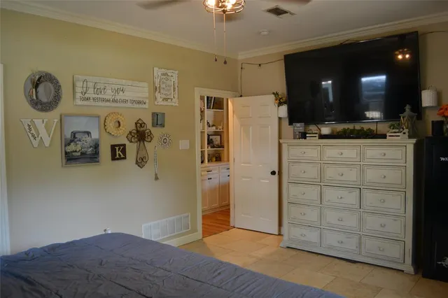 a view of a kitchen with refrigerator and microwave