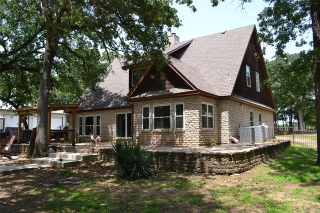a front view of house with yard outdoor seating and yard
