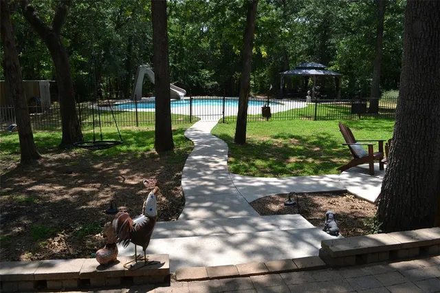 a view of a park with large trees