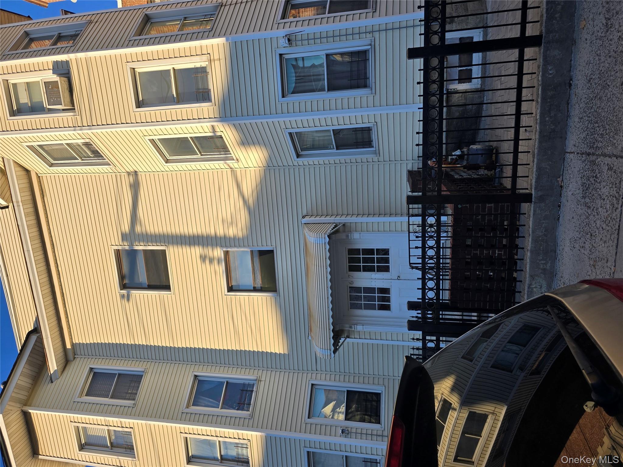 67 Radford Street, Unit 2E Yonkers, NY 10705 - Photo 1 of 19 a front view of a building with many windows