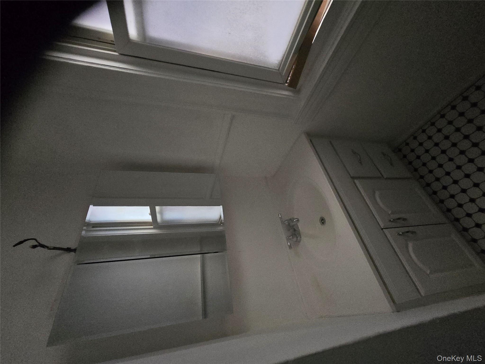 67 Radford Street, Unit 2E Yonkers, NY 10705 - Photo 11 of 19 a bathroom with a sink and a mirror