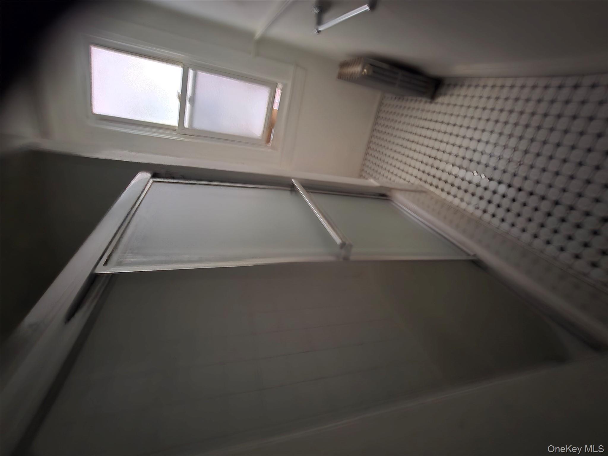 67 Radford Street, Unit 2E Yonkers, NY 10705 - Photo 10 of 19 a view of a closet with wooden floor