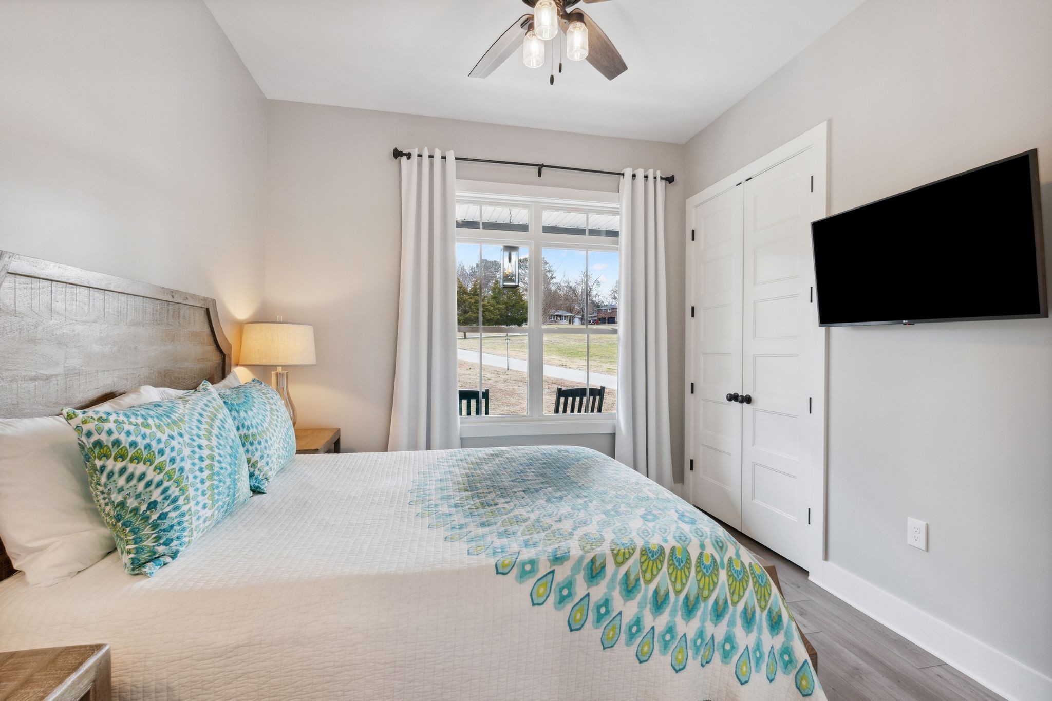 741 Saundersville Ferry Road Mount Juliet, TN 37122 - Photo 29 of 89 a bedroom with a bed and a flat screen tv