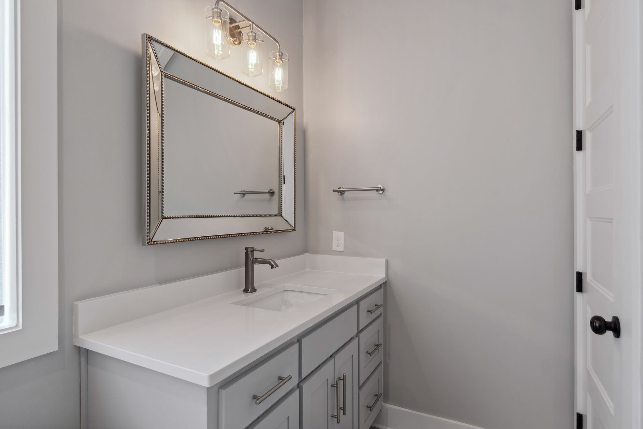 741 Saundersville Ferry Road Mount Juliet, TN 37122 - Photo 36 of 89 a bathroom with a sink vanity and mirror