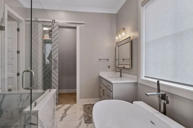 a bathroom with a sink and mirror