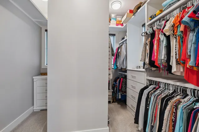 a bathroom with a granite countertop sink a toilet and bathtub
