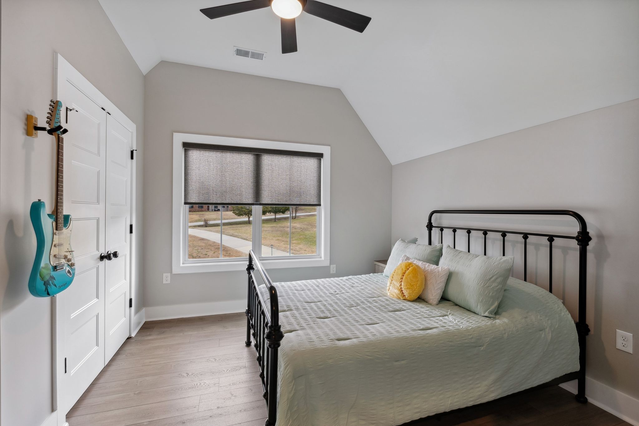 741 Saundersville Ferry Road Mount Juliet, TN 37122 - Photo 48 of 89 a bedroom with a large bed and a chandelier