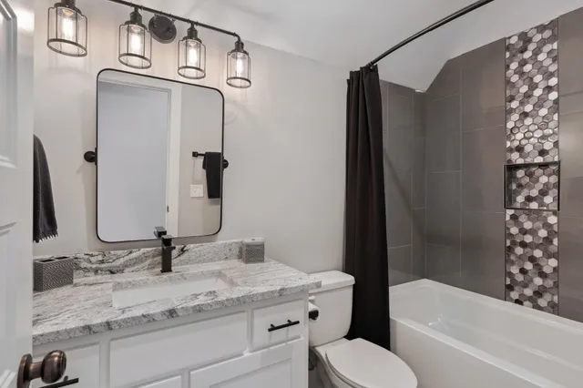 an aerial view of a house with a garden