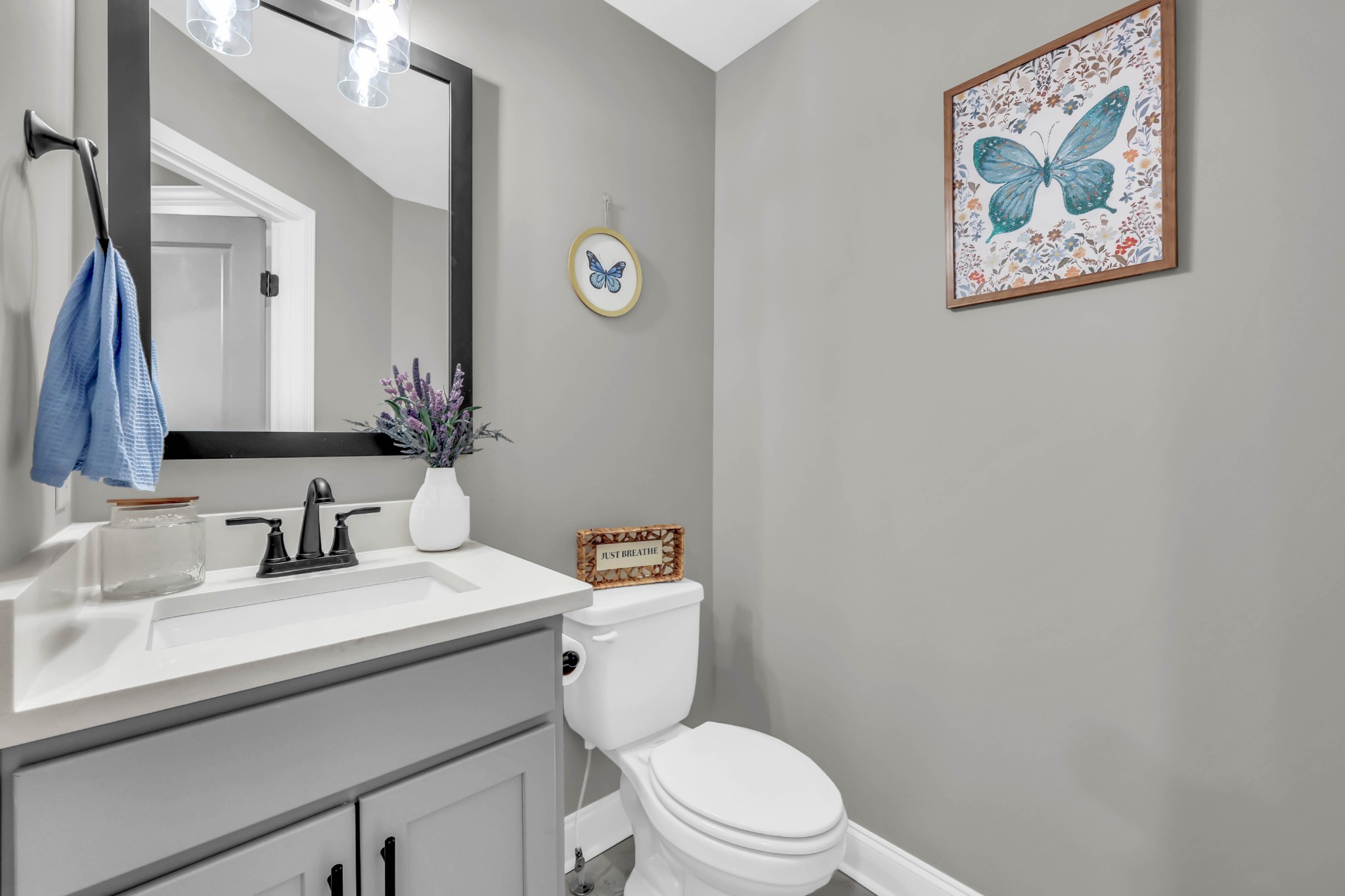 834 Limestone Way Clarksville, TN 37043 - Photo 14 of 26 a bathroom with a toilet sink and mirror