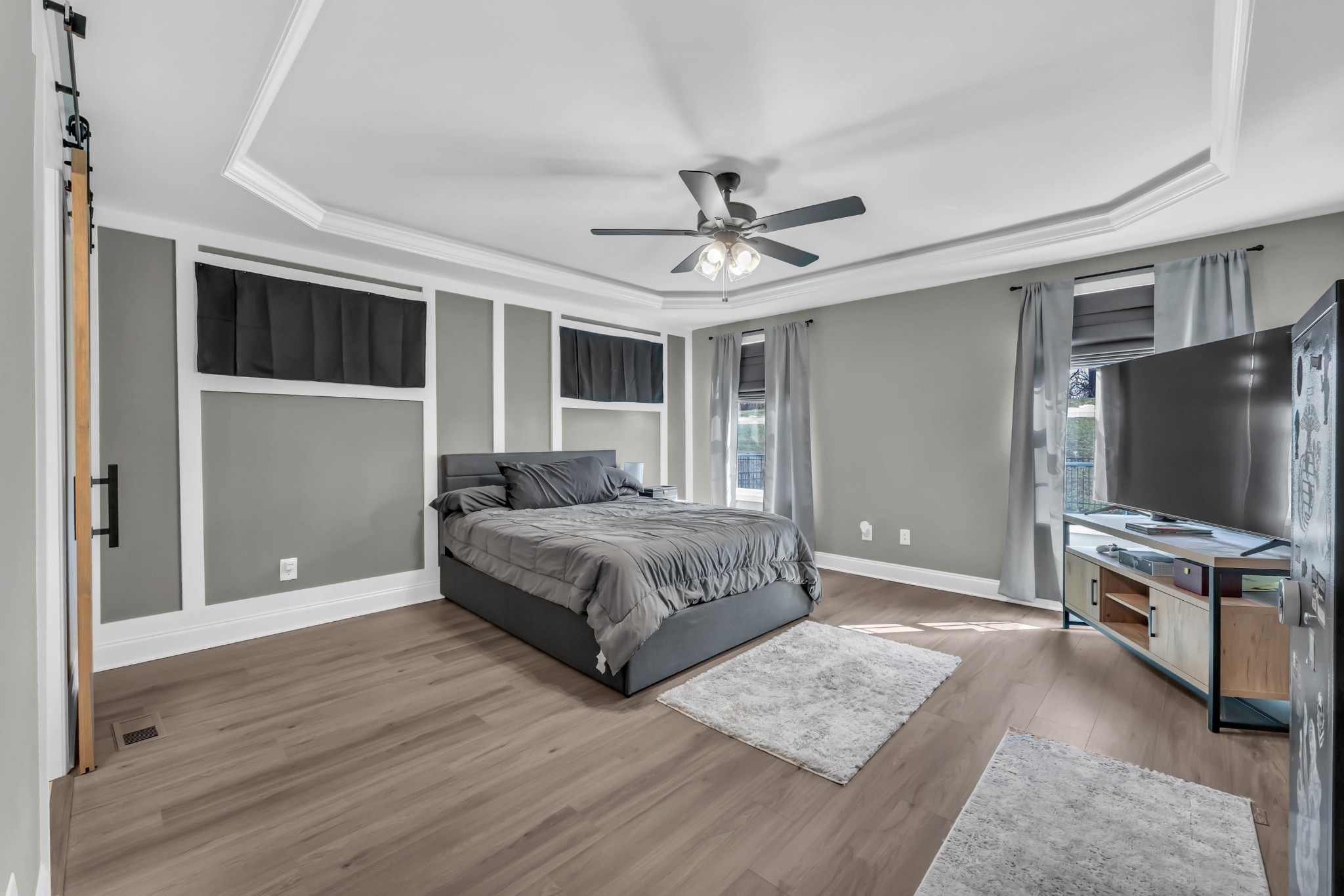 834 Limestone Way Clarksville, TN 37043 - Photo 15 of 26 a bedroom with a bed and a flat screen tv